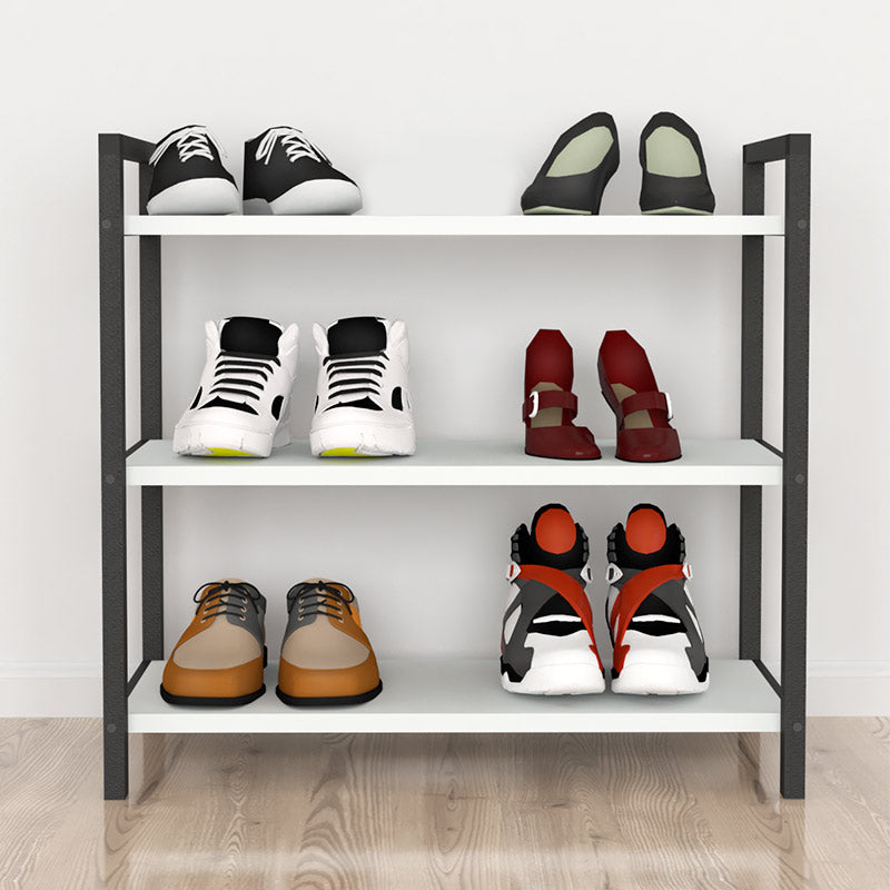 Shoe Rack UTILE in black and white, holding 9 pairs of shoes, featuring three shelves and a modern design.