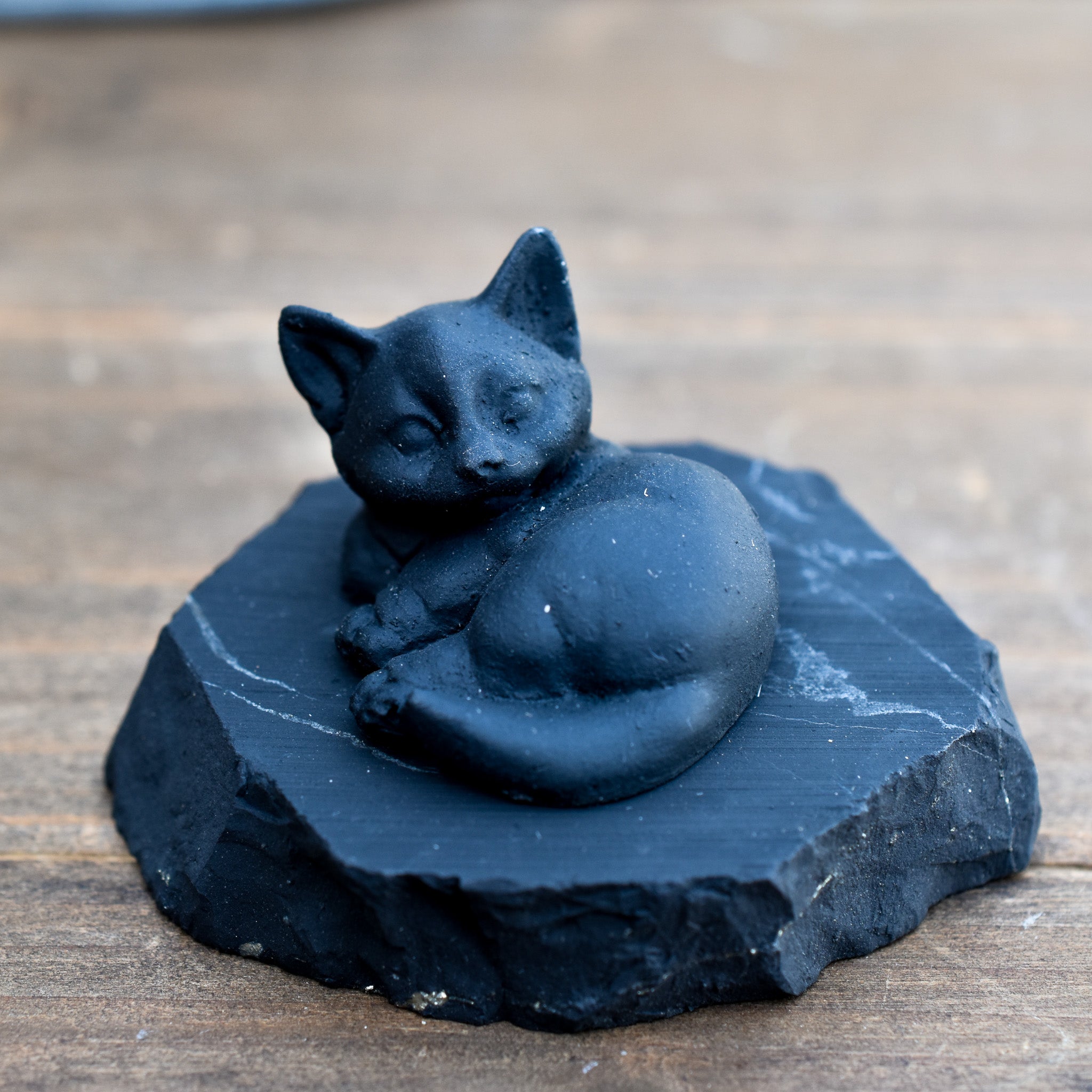 A collection of adorable Shungite Animal Figurines showcasing various animal designs, crafted from black shungite stone.