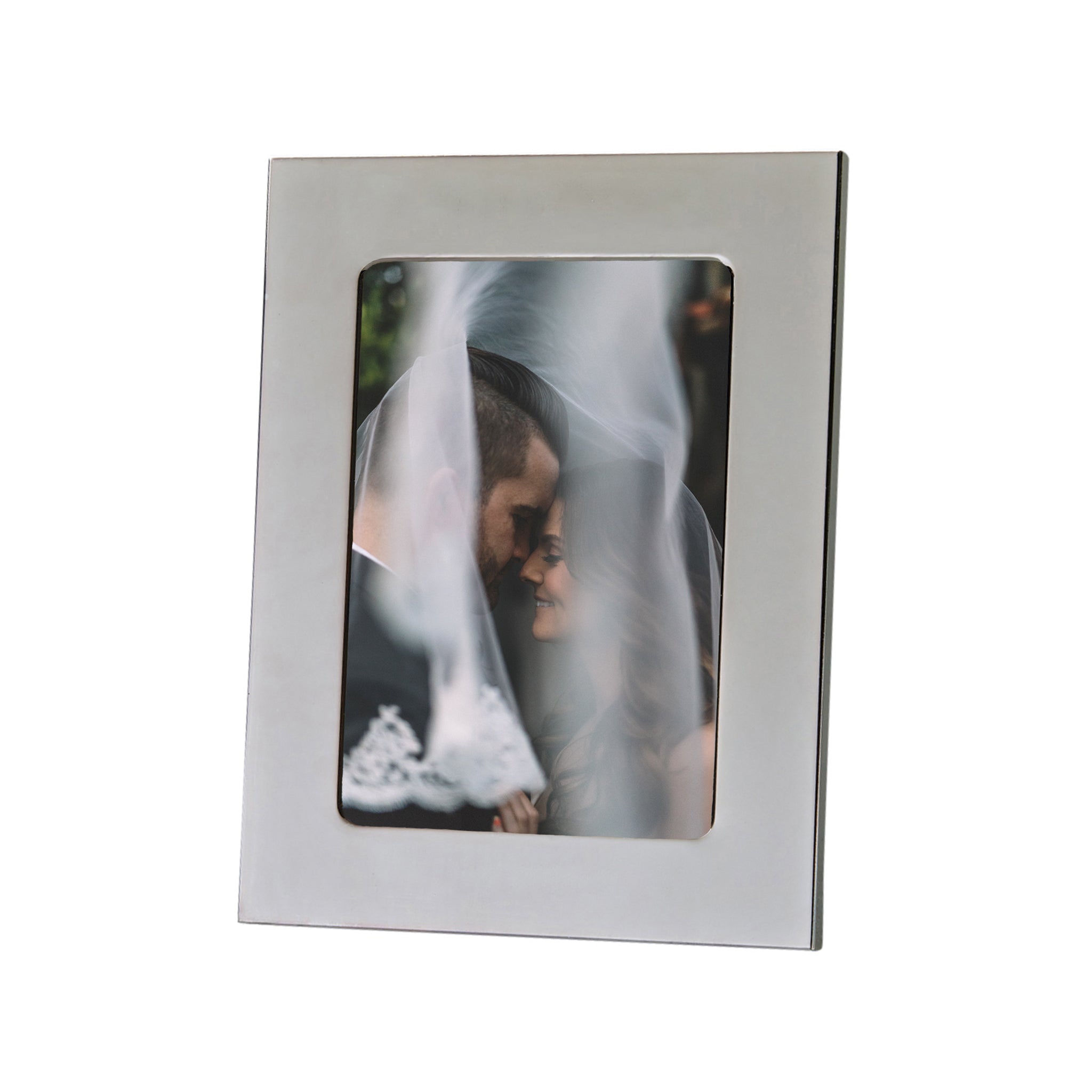 Elegant Silhouette Photo Frame in bright metal, designed for 5x7 photos with a black flocked backing.