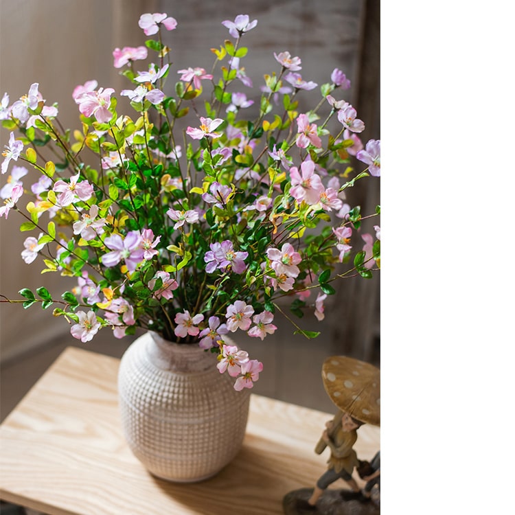 A 20-inch tall Silk Faux Gaura Flower Stem in pink, featuring realistic petals and dark green leaves, perfect for home decor.