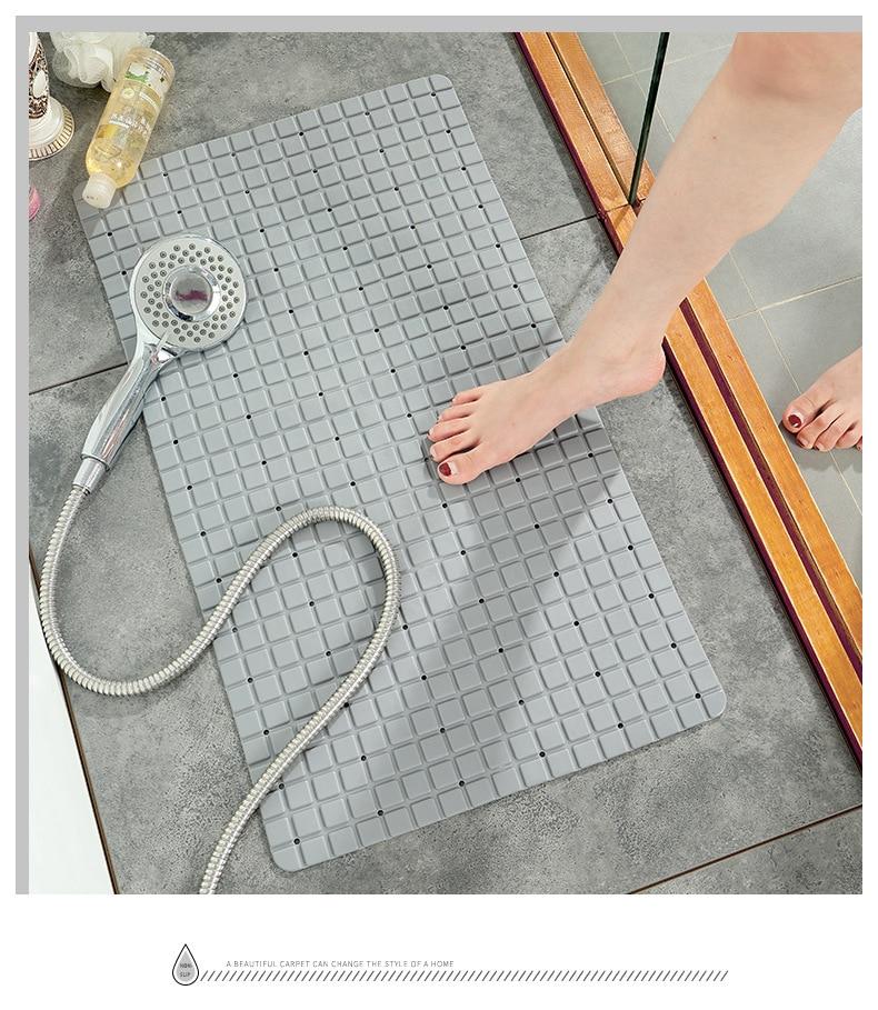 A large, eco-friendly PVC bath mat with a modern plaid pattern, featuring a non-slip surface for safety in the bathroom.