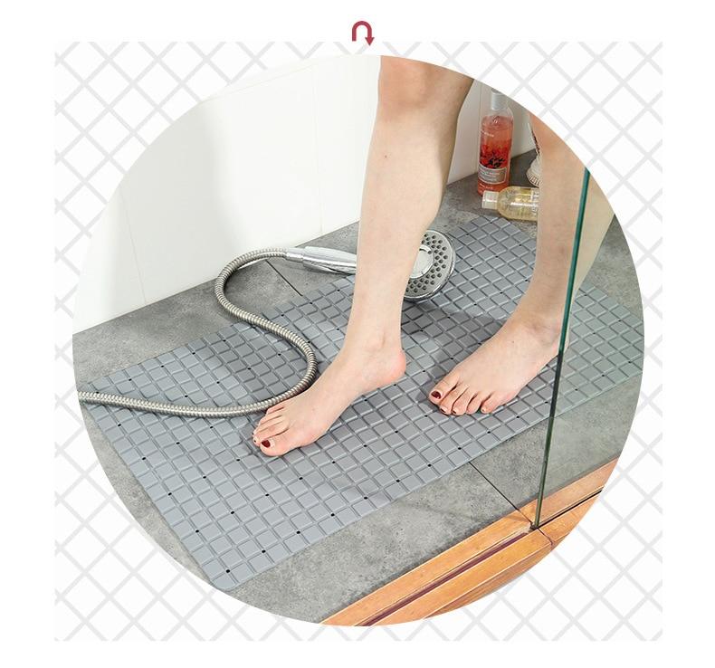 A large, eco-friendly PVC bath mat with a modern plaid pattern, featuring a non-slip surface for safety in the bathroom.