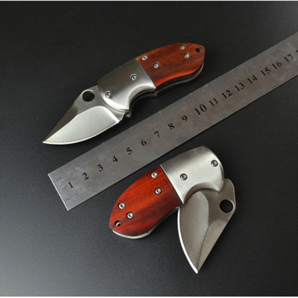 Small Mini Stainless Steel Folding Pocket Knife with shadow wood handle and keychain attachment, ideal for outdoor use.