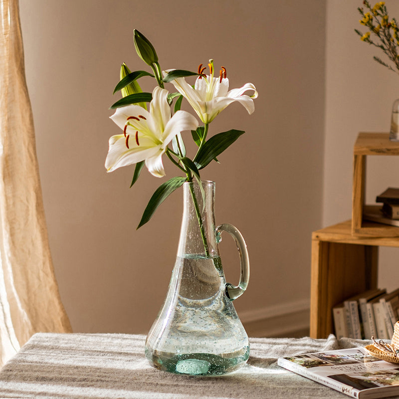 A 13-inch tall bubble glass kettle vase with a small opening, featuring a clear and light green color, perfect for floral arrangements.