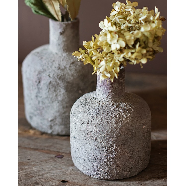 A handmade small opening stoneware terracotta vase in gray and white, showcasing its unique shape and artisanal quality.