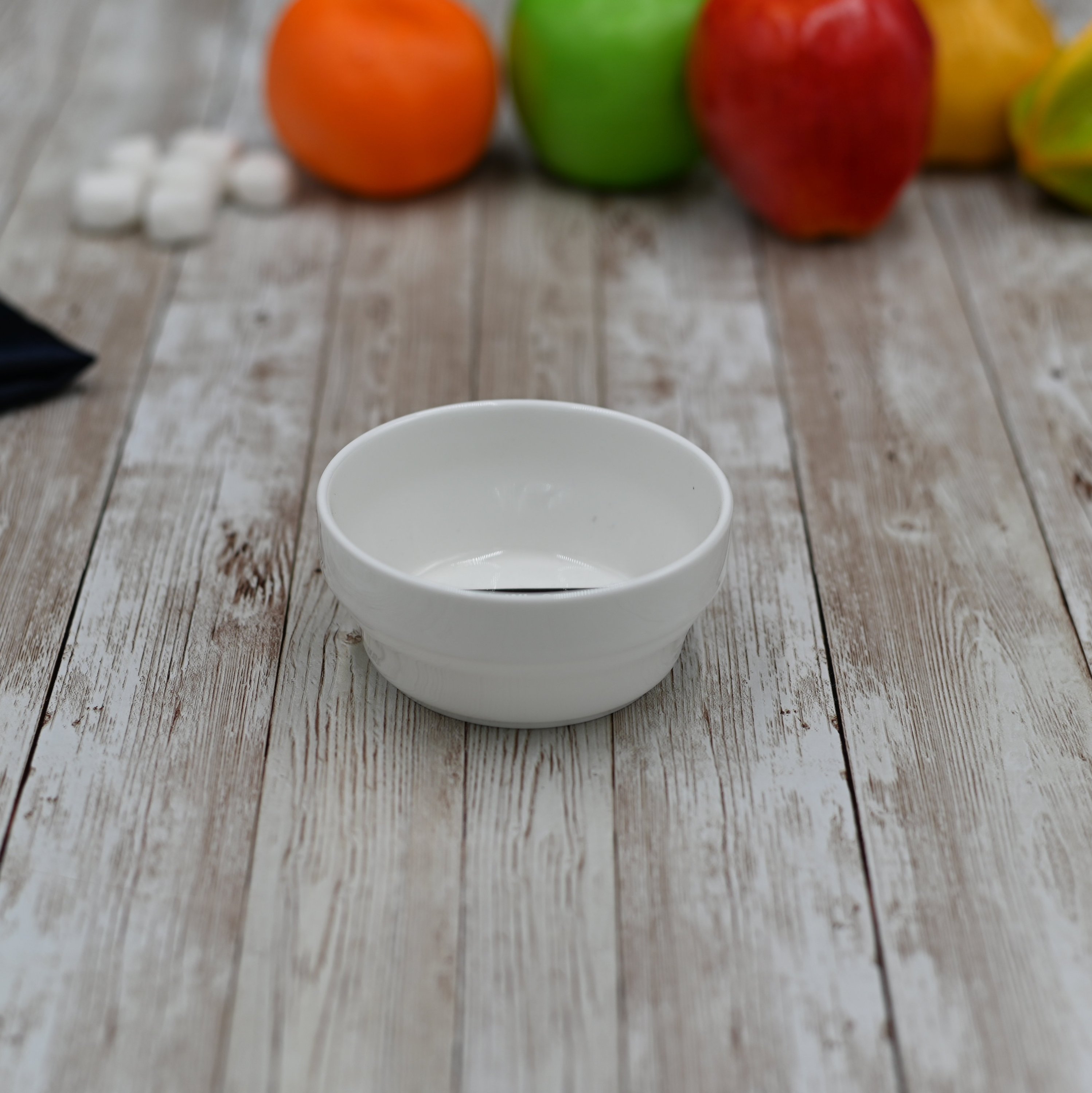 Small white bowl measuring 3.5 inches, perfect for soups and salads, made of durable porcelain.