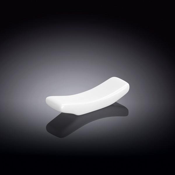 A sleek small white porcelain chopstick rest with a circular design, ideal for holding chopsticks and utensils securely.