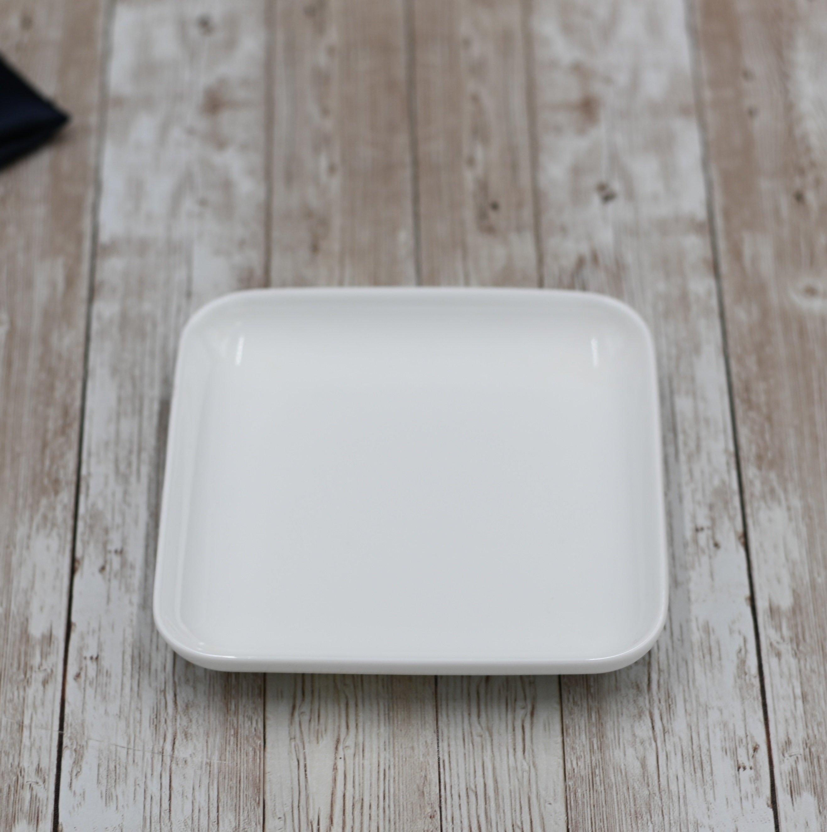 Small White Square Dish measuring 5 inches by 5 inches, made of fine porcelain with a rolled rim design.