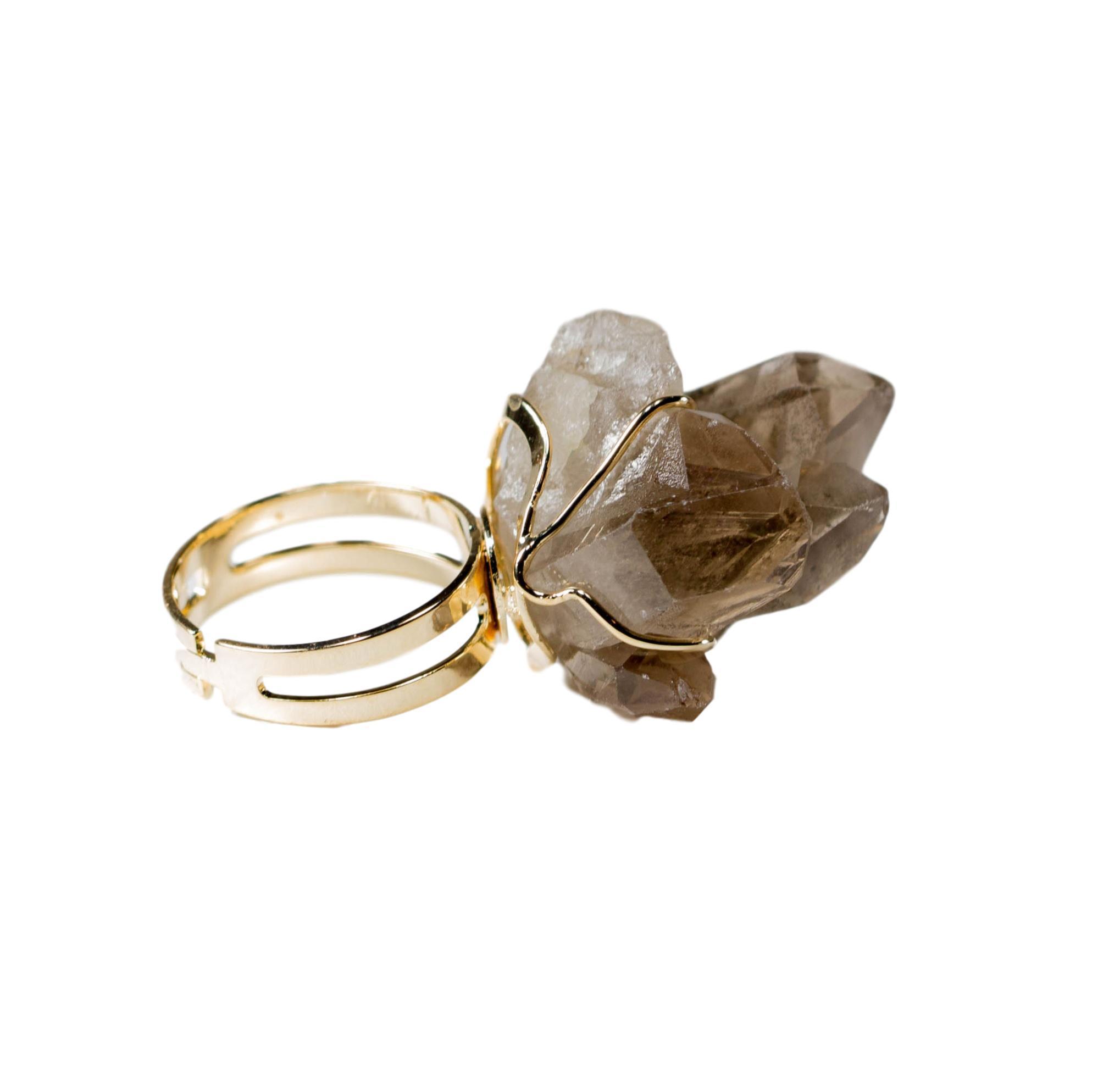 A stunning smoky quartz ring wrapped in gold or silver wire, showcasing its unique gemstone and elegant design.