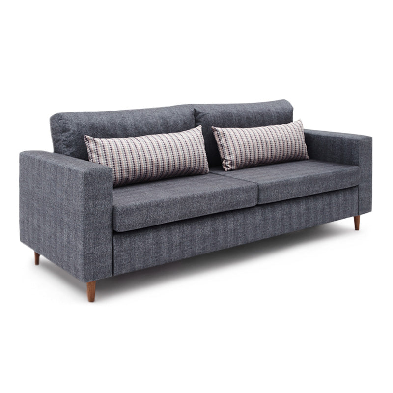 RIO three-seater sofa in anthracite fabric with walnut legs, showcasing its modern design and spacious seating.