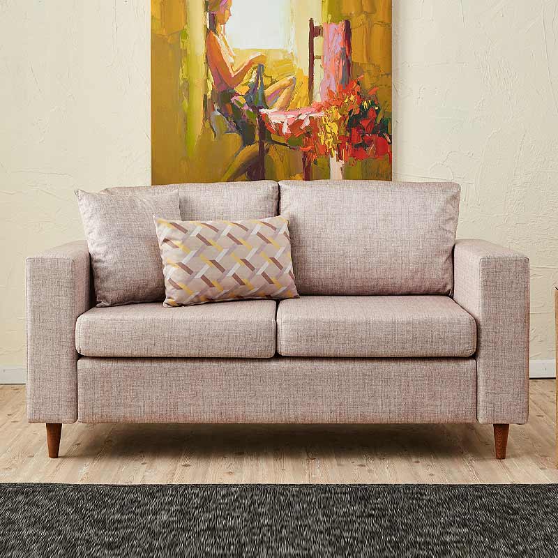 AUGUSTA Cream two-seater sofa featuring elegant fabric upholstery and walnut wooden legs.