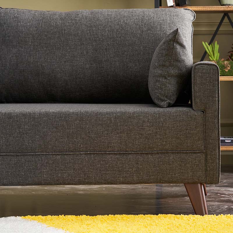 UTE three-seater sofa in anthracite color, featuring a modern design with durable fabric upholstery and walnut wood look legs.