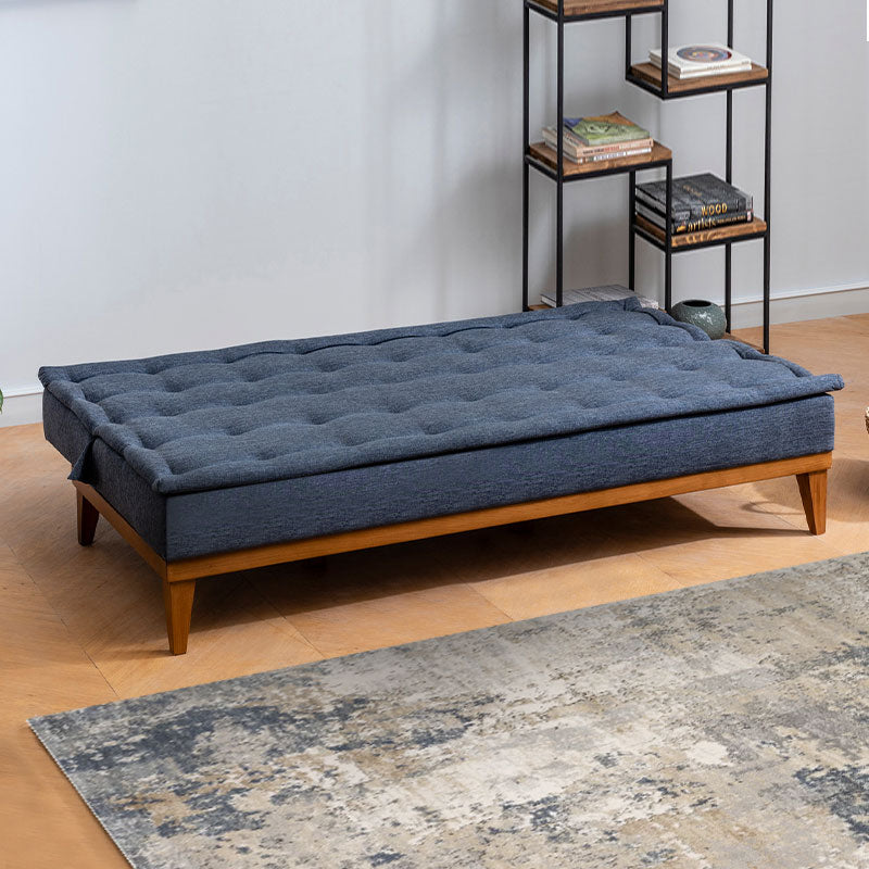 Sofa-Bed LONDON in dark blue fabric, showcasing its three-seater design and elegant minimalistic style.