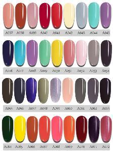 A collection of vibrant solid color nail polishes in various shades, showcasing their glossy finish and precision brushes.