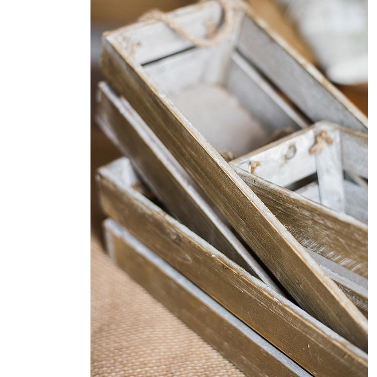 Solid wood crate with rope handles, showcasing natural wood finish and three available sizes.