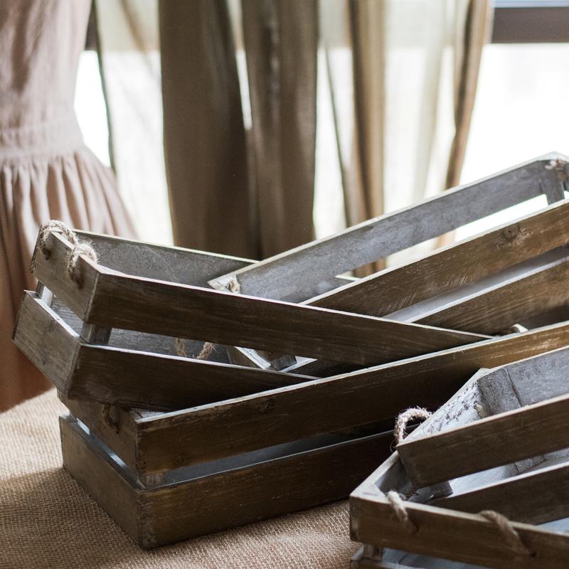 Solid wood crate with rope handles, showcasing natural wood finish and three available sizes.