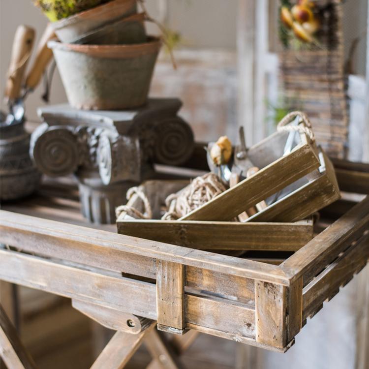 Solid wood crate with rope handles, showcasing a natural wood finish and sturdy design, perfect for storage and decor.