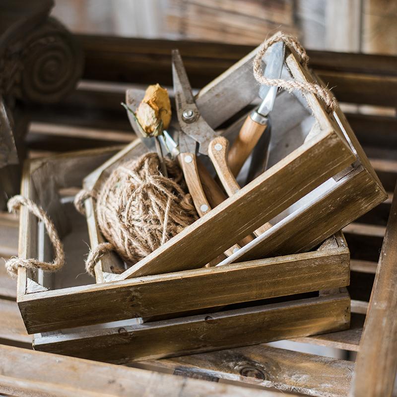 Solid wood crate with rope handles, showcasing a natural wood finish and sturdy design, perfect for storage and decor.