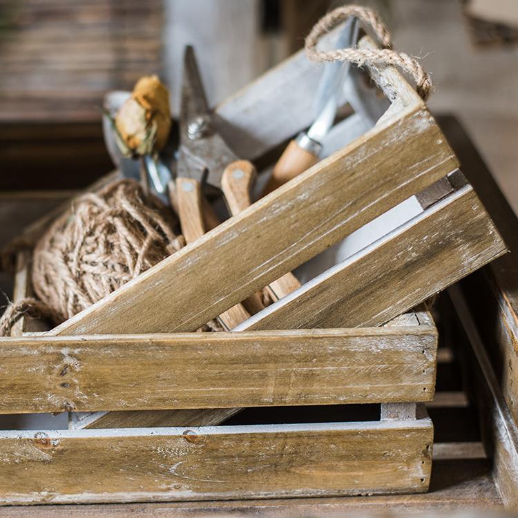 Solid wood crate with rope handles, showcasing a natural wood finish and sturdy design, perfect for storage and decor.