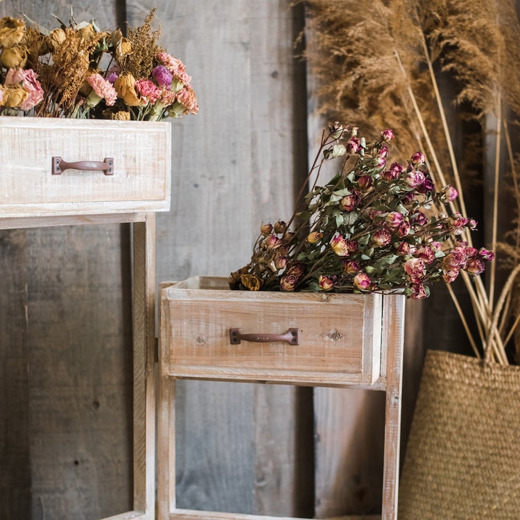 Solid wood decorative plant stand with drawer, showcasing a natural tan finish and sturdy design, perfect for indoor plants.