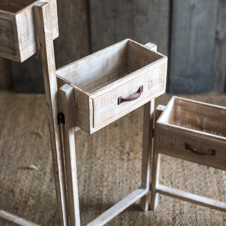 Solid wood decorative plant stand with drawer, showcasing a natural tan finish and sturdy design, perfect for indoor plants.