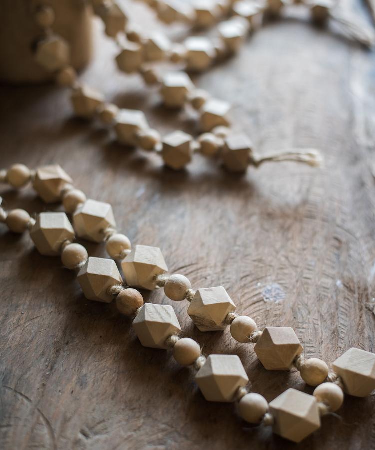 Solid wood handmade rustic curtain tiebacks in beige and khaki colors, showcasing their elegant design and craftsmanship.