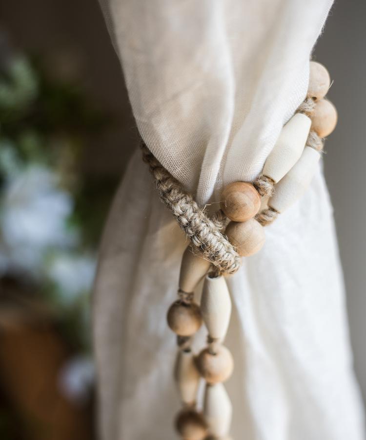 Solid wood handmade rustic curtain tiebacks in beige and khaki colors, showcasing their elegant design and craftsmanship.