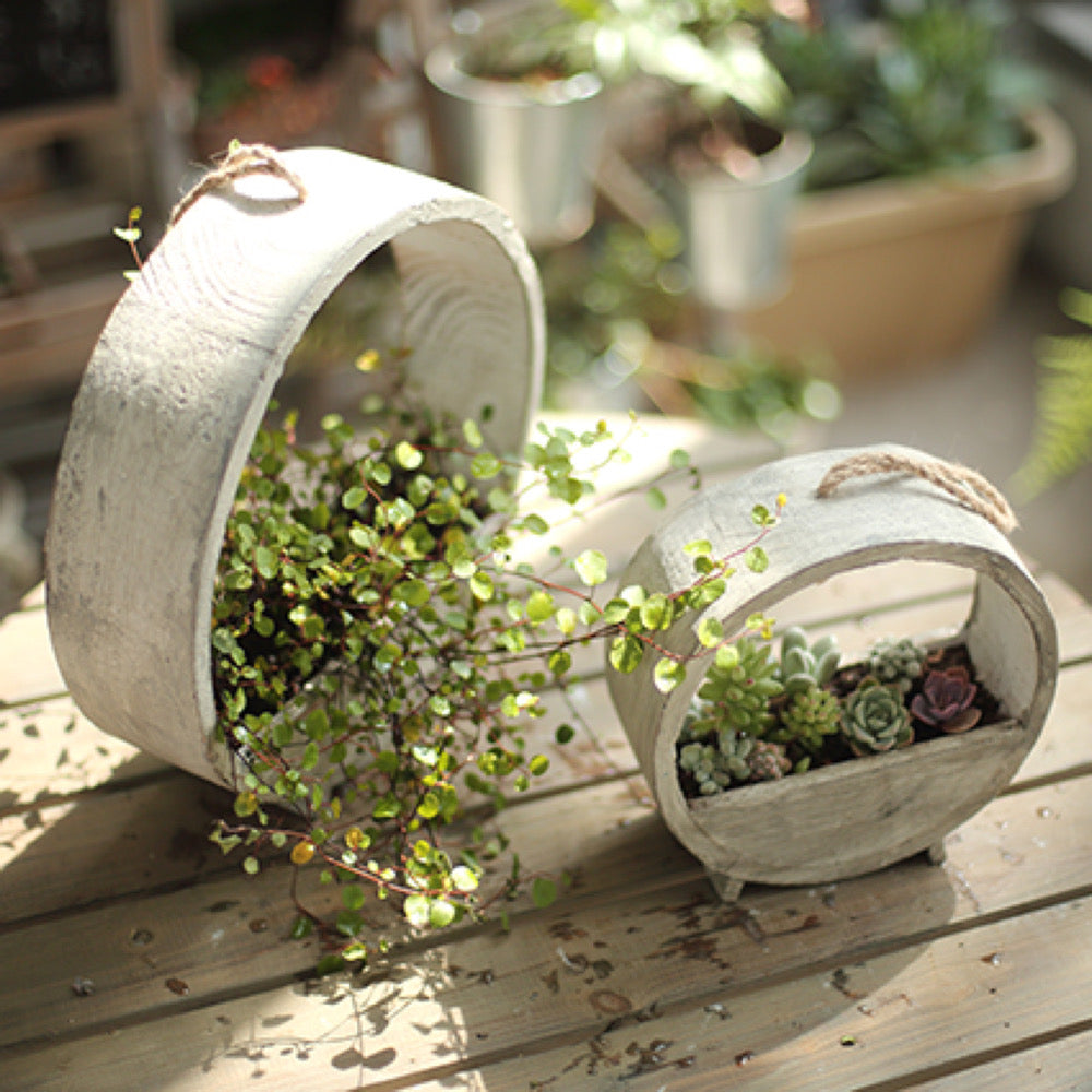 Solid Wood Hanging Planter in round shape, crafted from Paulownia wood, available in white and light gray colors.