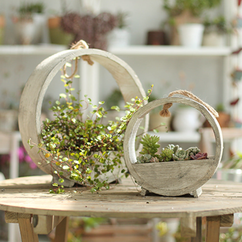 Solid Wood Hanging Planter in round shape, crafted from Paulownia wood, available in white and light gray colors.