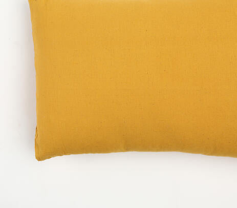 Solid yellow cotton cushion cover with concealed zip closure, showcasing a minimalist design, perfect for indoor and outdoor decor.