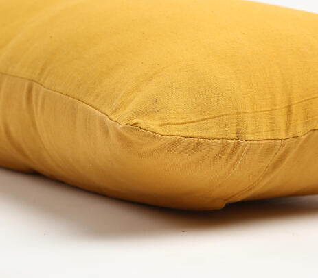 Solid yellow cotton cushion cover with concealed zip closure, showcasing a minimalist design, perfect for indoor and outdoor decor.