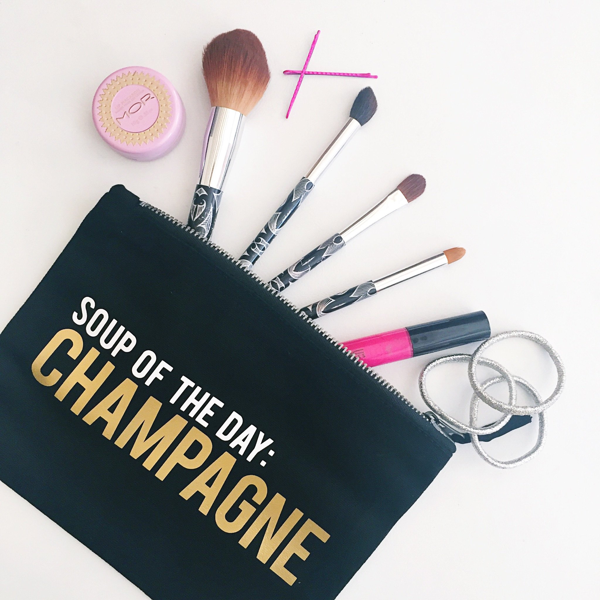 Soup Of The Day - Champagne Makeup Bag featuring a chic design with hot stamped phrase in white and metallic gold ink, gold zipper, and made of Egyptian cotton.