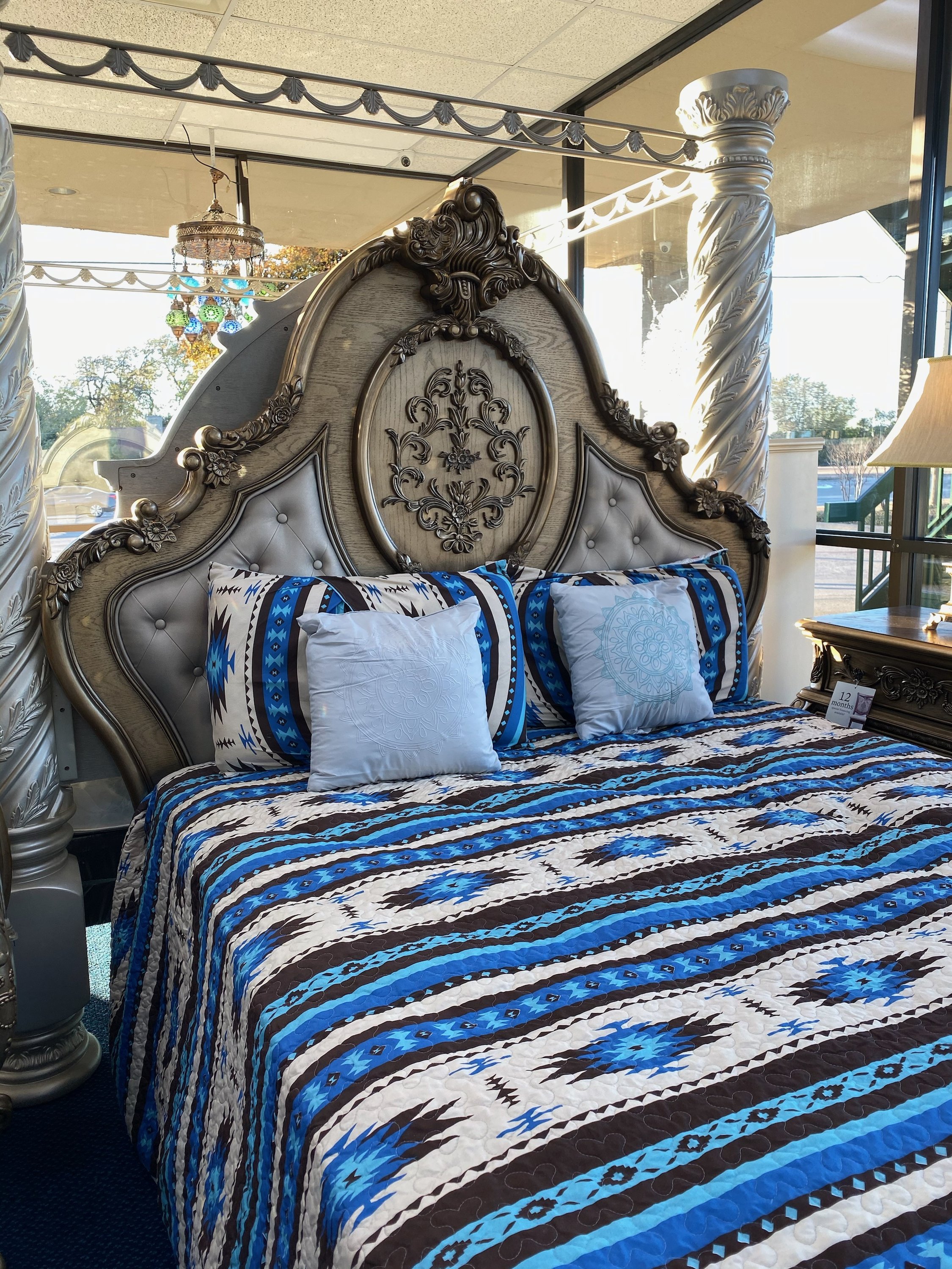 Southwest Feathers & Flowers Bull Skull Aztec Quilt Coverlet set featuring a bull skull design with colorful feathers and flowers, includes quilt and pillows.