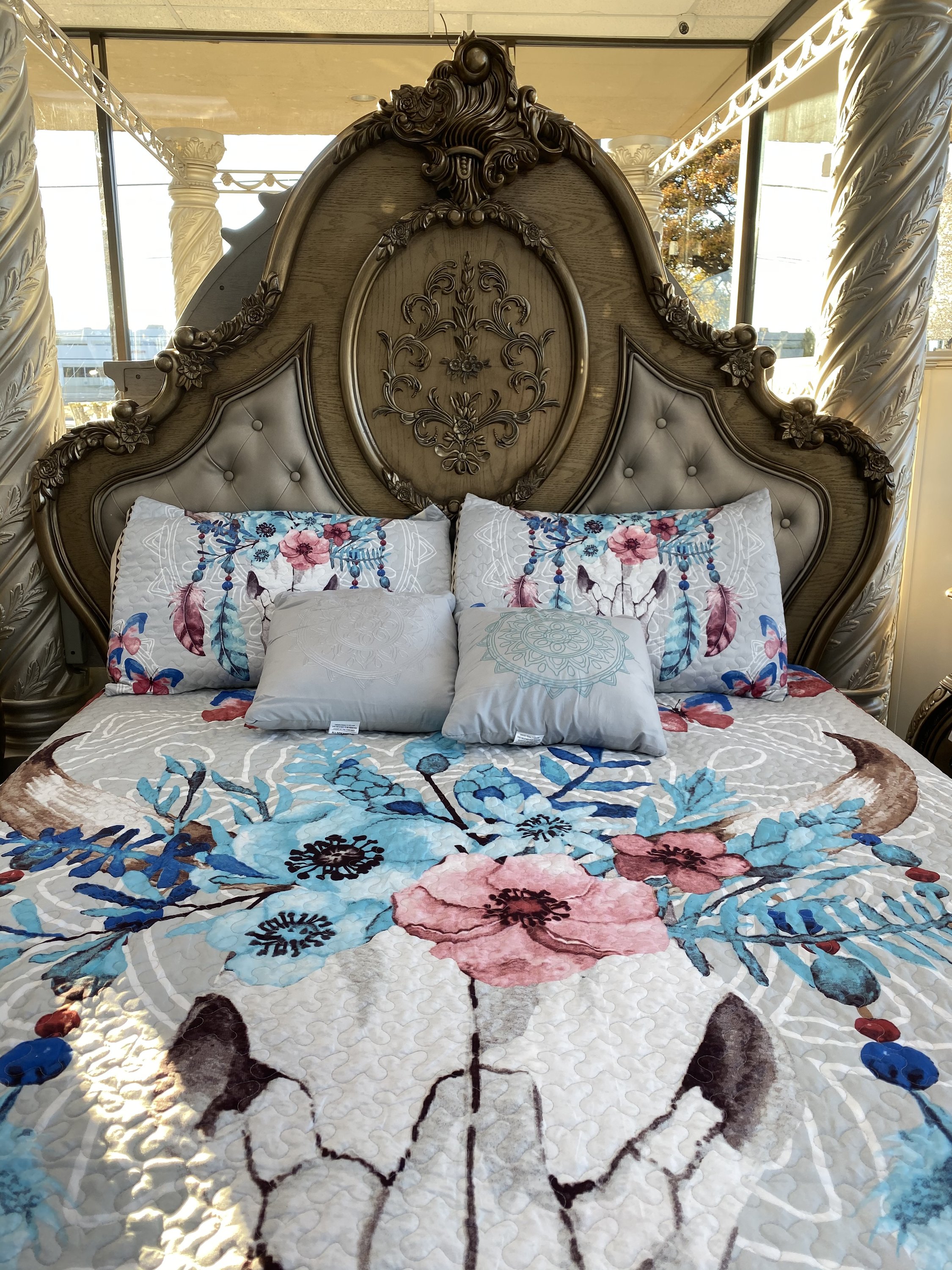 Southwest Feathers & Flowers Bull Skull Aztec Quilt Coverlet set featuring a bull skull design with colorful feathers and flowers, includes quilt and pillows.