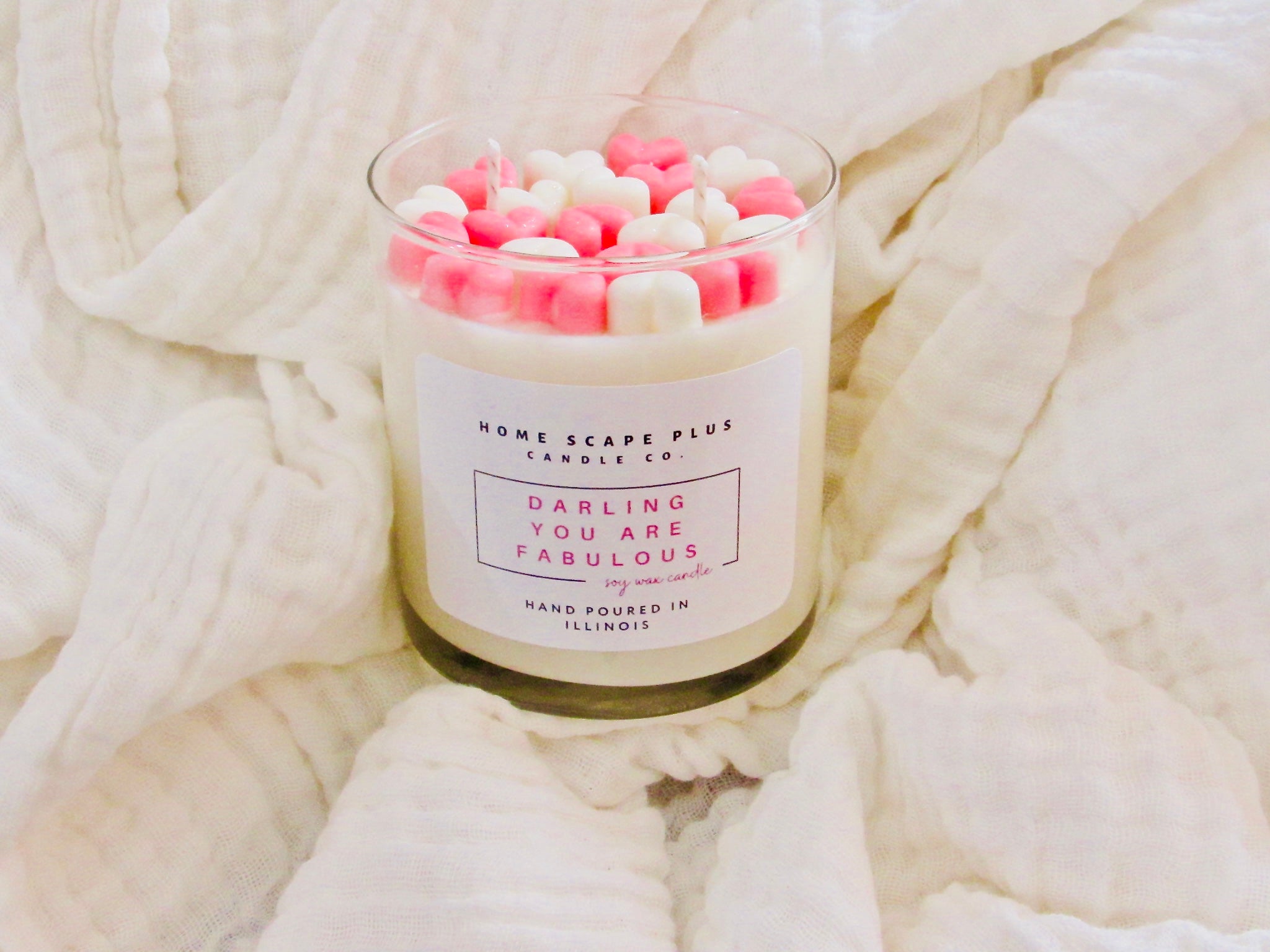 A beautifully crafted soy wax candle with heart shapes, featuring creamy vanilla notes and a warm glow, perfect for home decor or gifting.