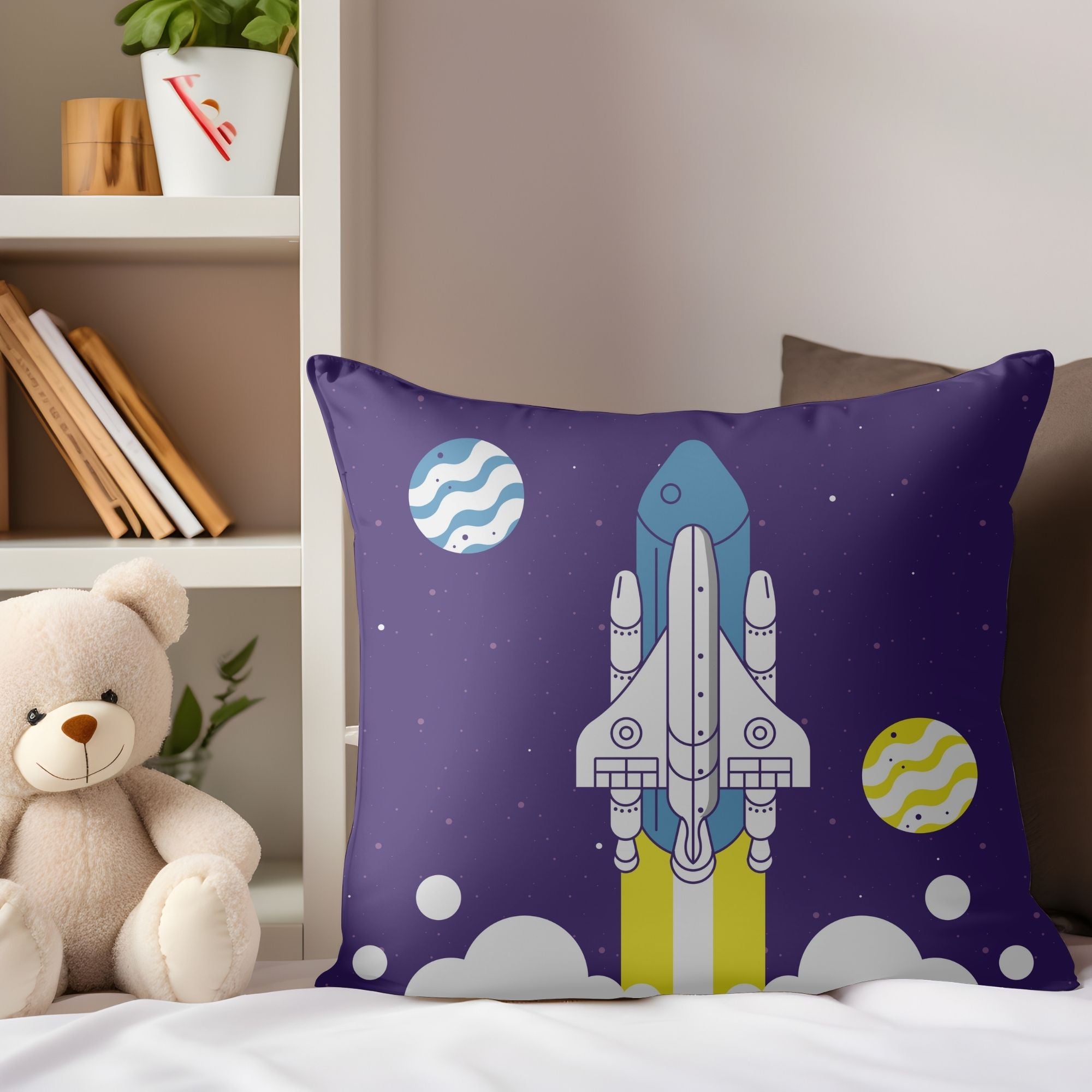 A colorful kids pillow featuring a vibrant space rocket design, perfect for children's rooms and outdoor use.