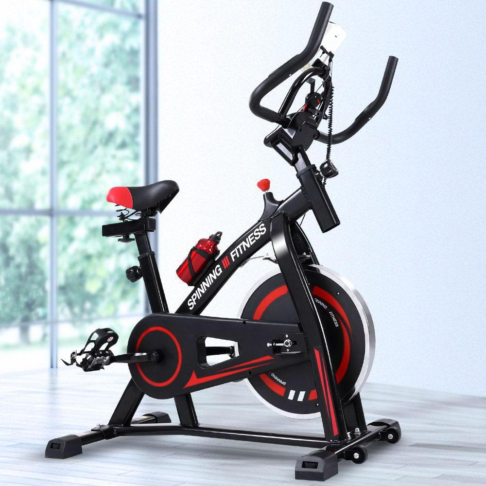 Spin Exercise Bike with adjustable seat and handlebars, featuring a stainless steel flywheel and LCD monitor for home workouts.