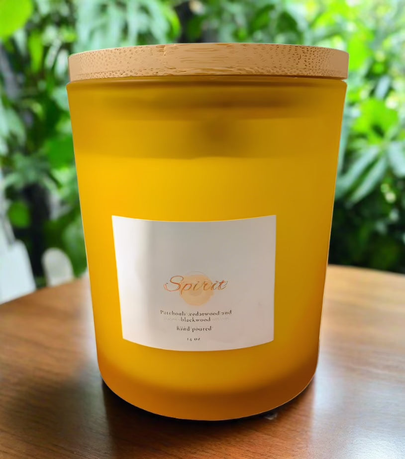 Spirit 14 oz Soy Candle in a frosted glass container with a bamboo lid, showcasing its elegant design and natural materials.