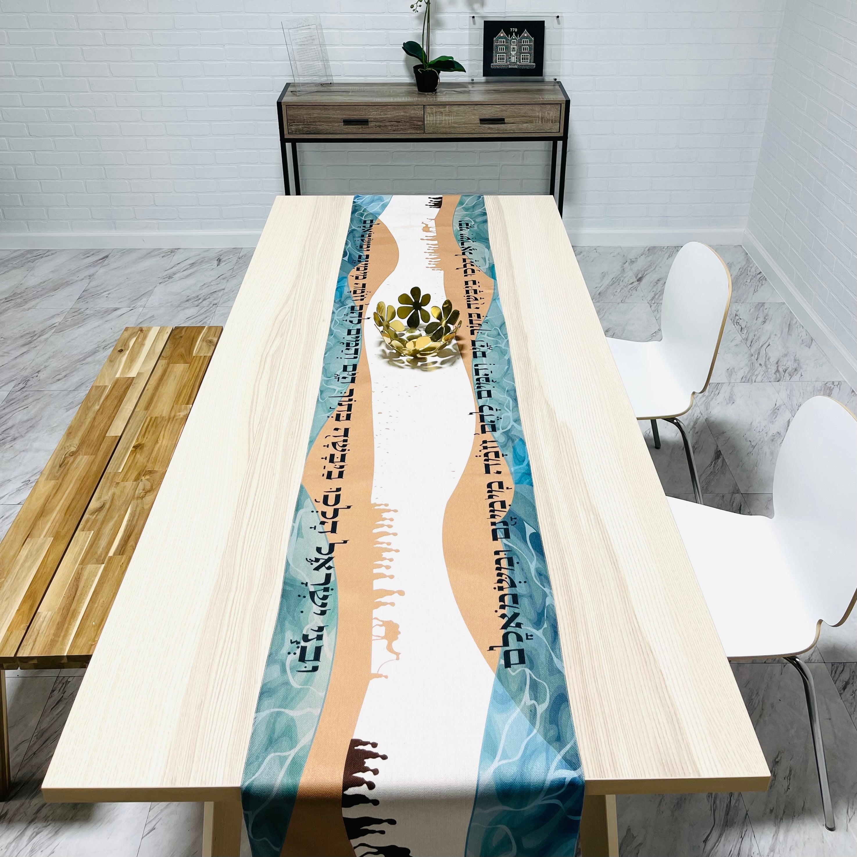 Elegant Split the Sea Passover Table Runner featuring Hebrew writing and beautiful icons, made from cotton linen blend and soft satin.