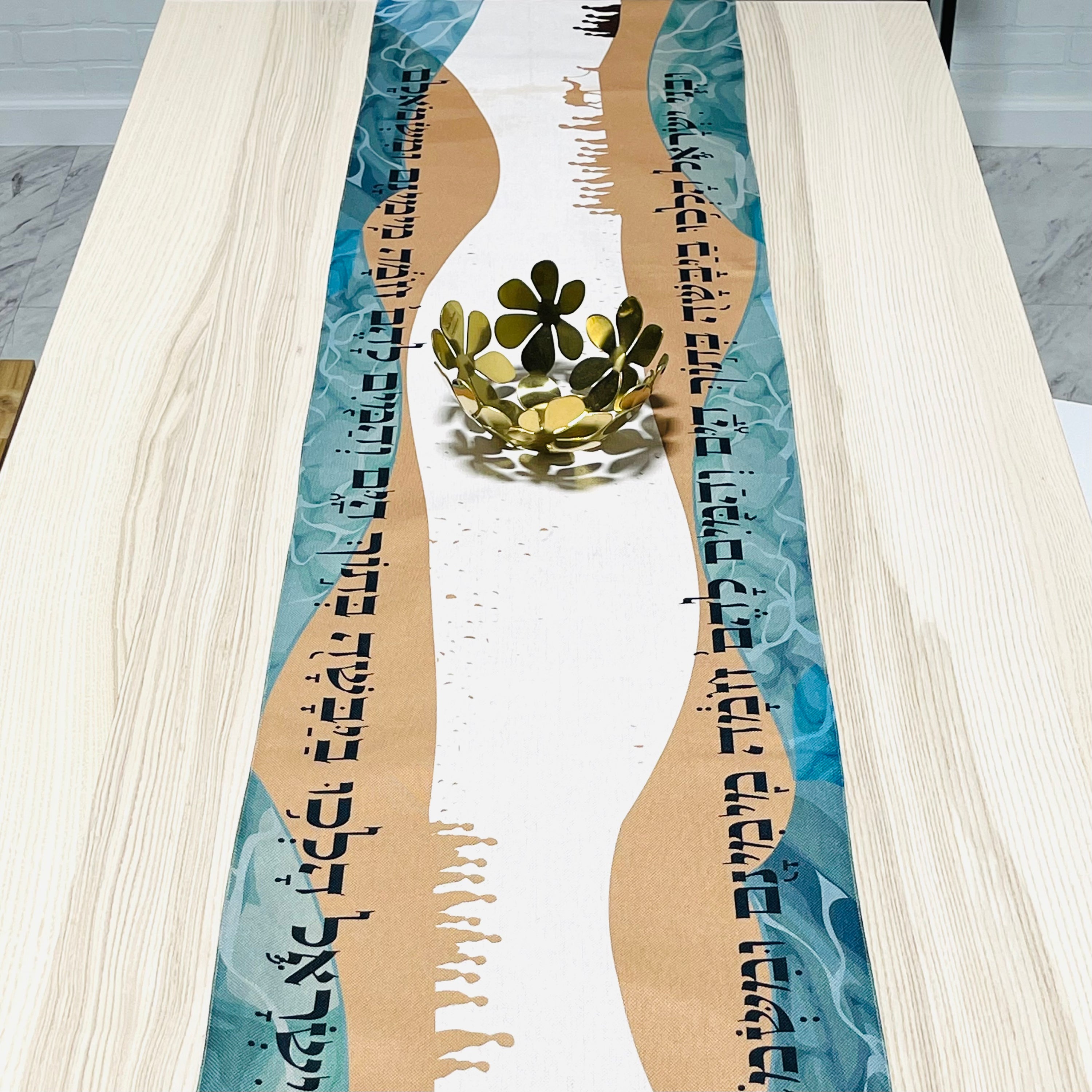 Elegant Split the Sea Passover Table Runner featuring Hebrew writing and beautiful icons, made from cotton linen blend and soft satin.