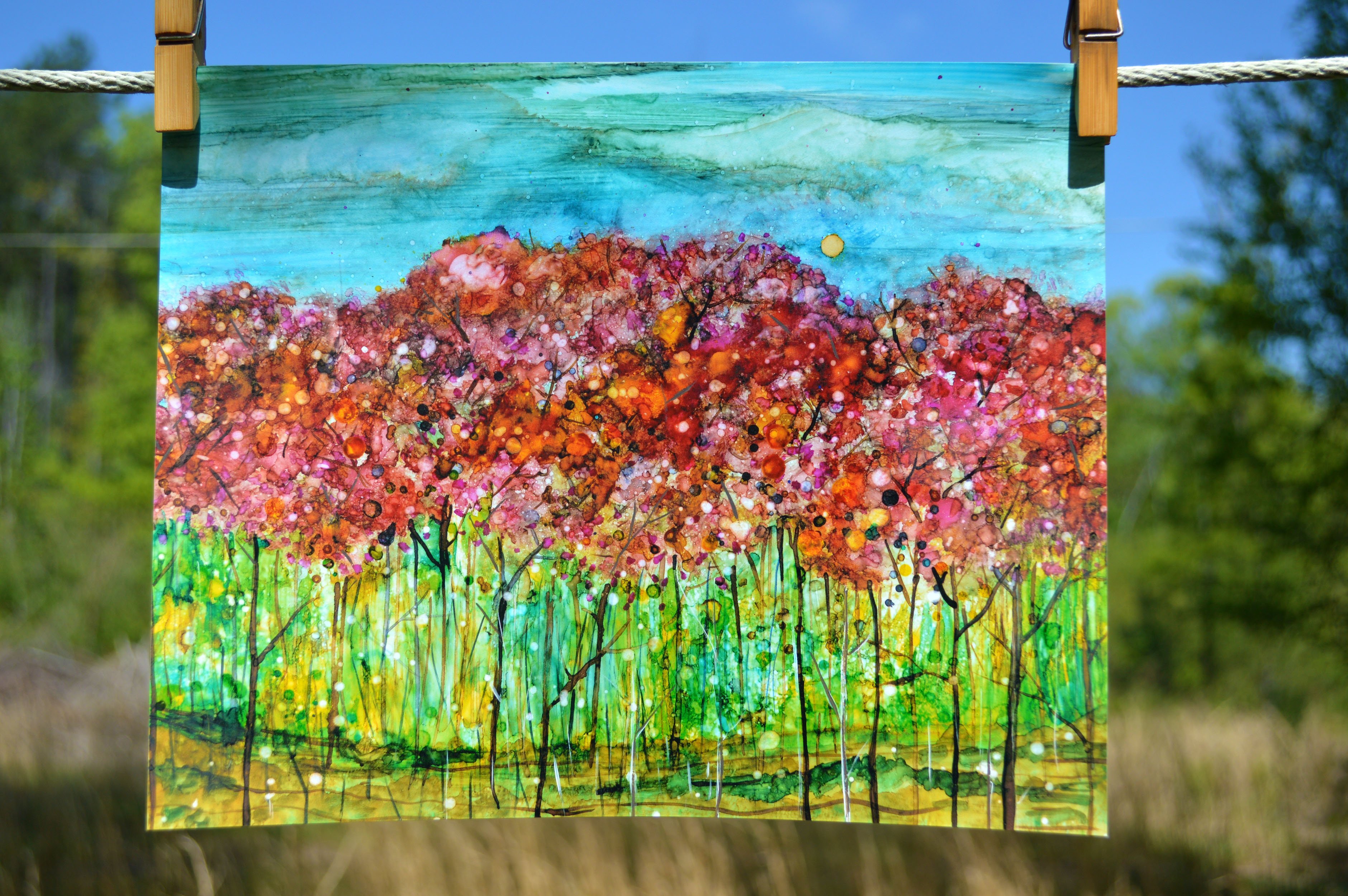 A vibrant Spring Forest landscape painting created with alcohol inks, showcasing dreamy colors and intricate details.