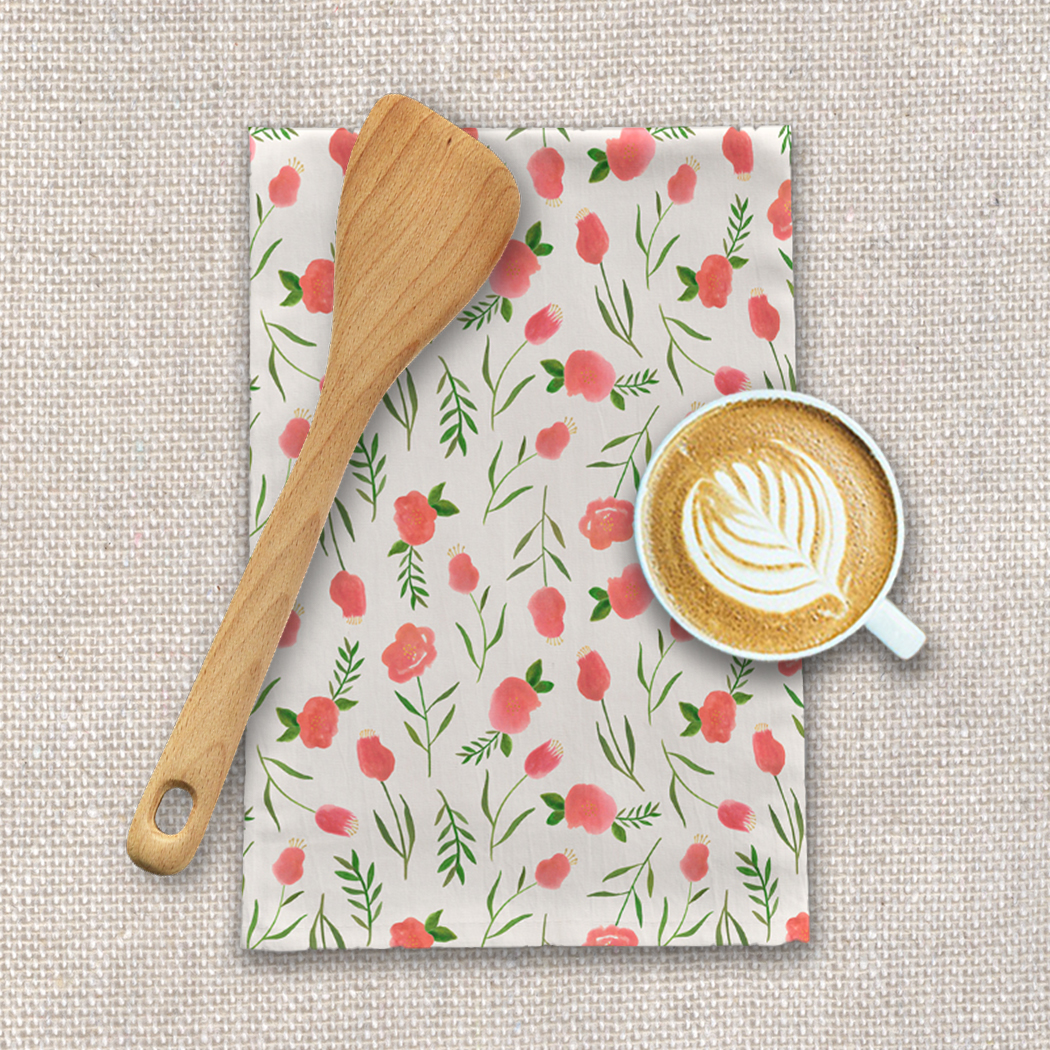 A colorful Spring Watercolor Tea Towel featuring floral designs on a cotton twill fabric, perfect for kitchen use.