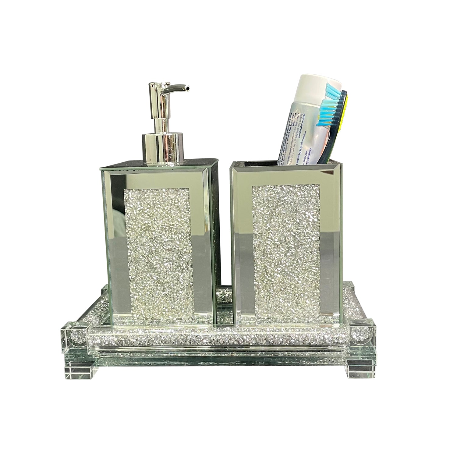 Square soap dispenser and toothbrush holder set in silver crushed diamond design, featuring chrome accents and an elegant tray.