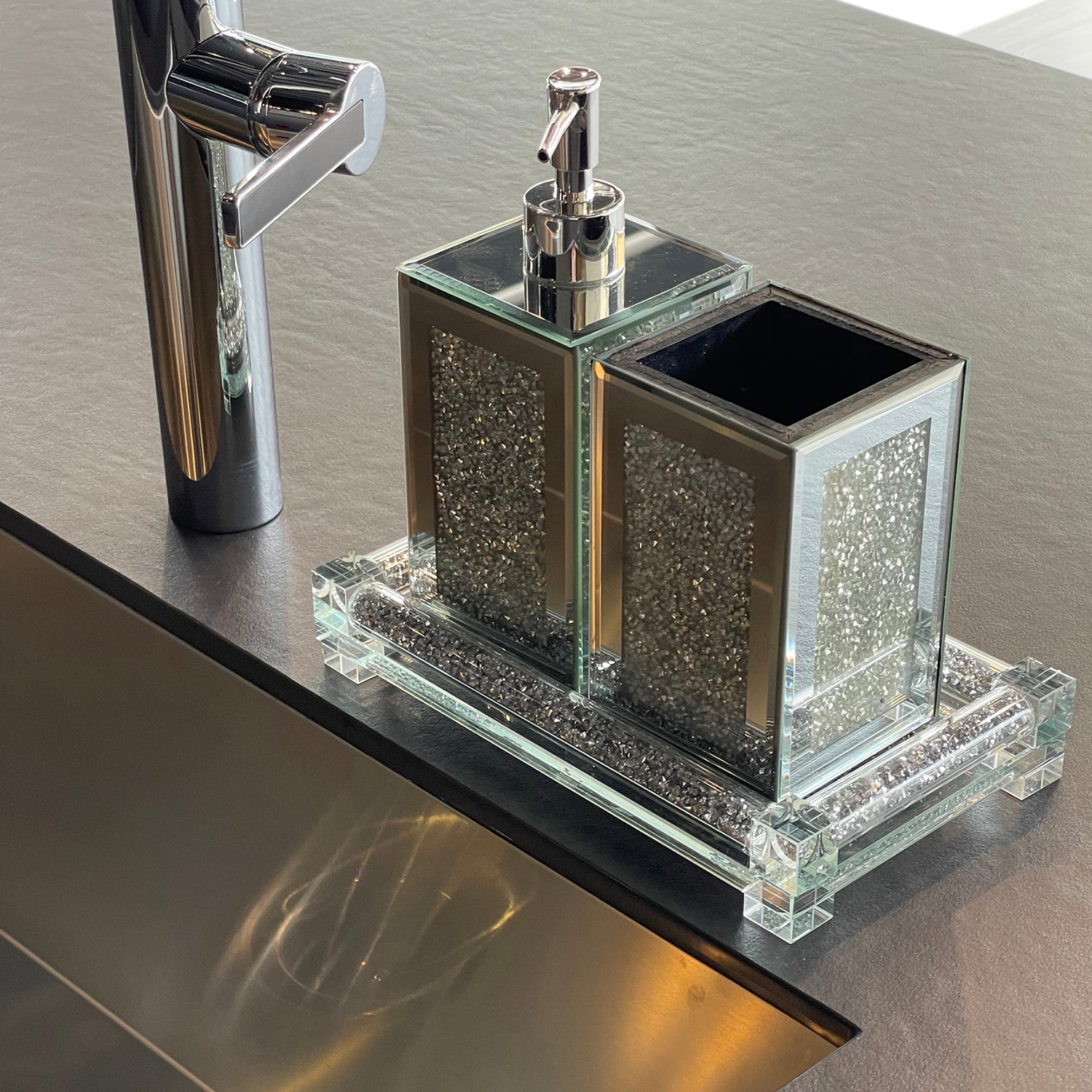 Square soap dispenser and toothbrush holder set in silver crushed diamond design, featuring chrome accents and an elegant tray.