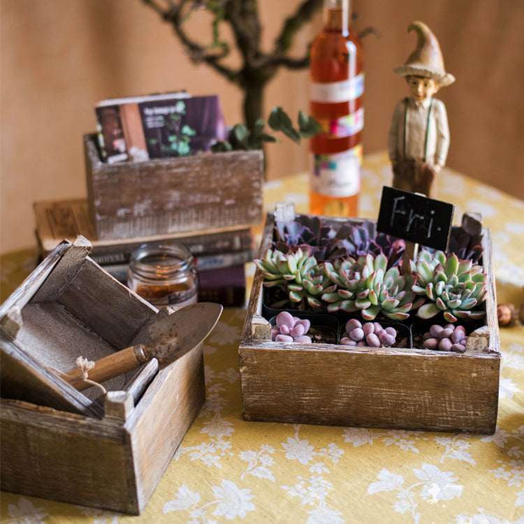 Set of three square solid wood boxes in natural brown color, showcasing different sizes for versatile storage solutions.