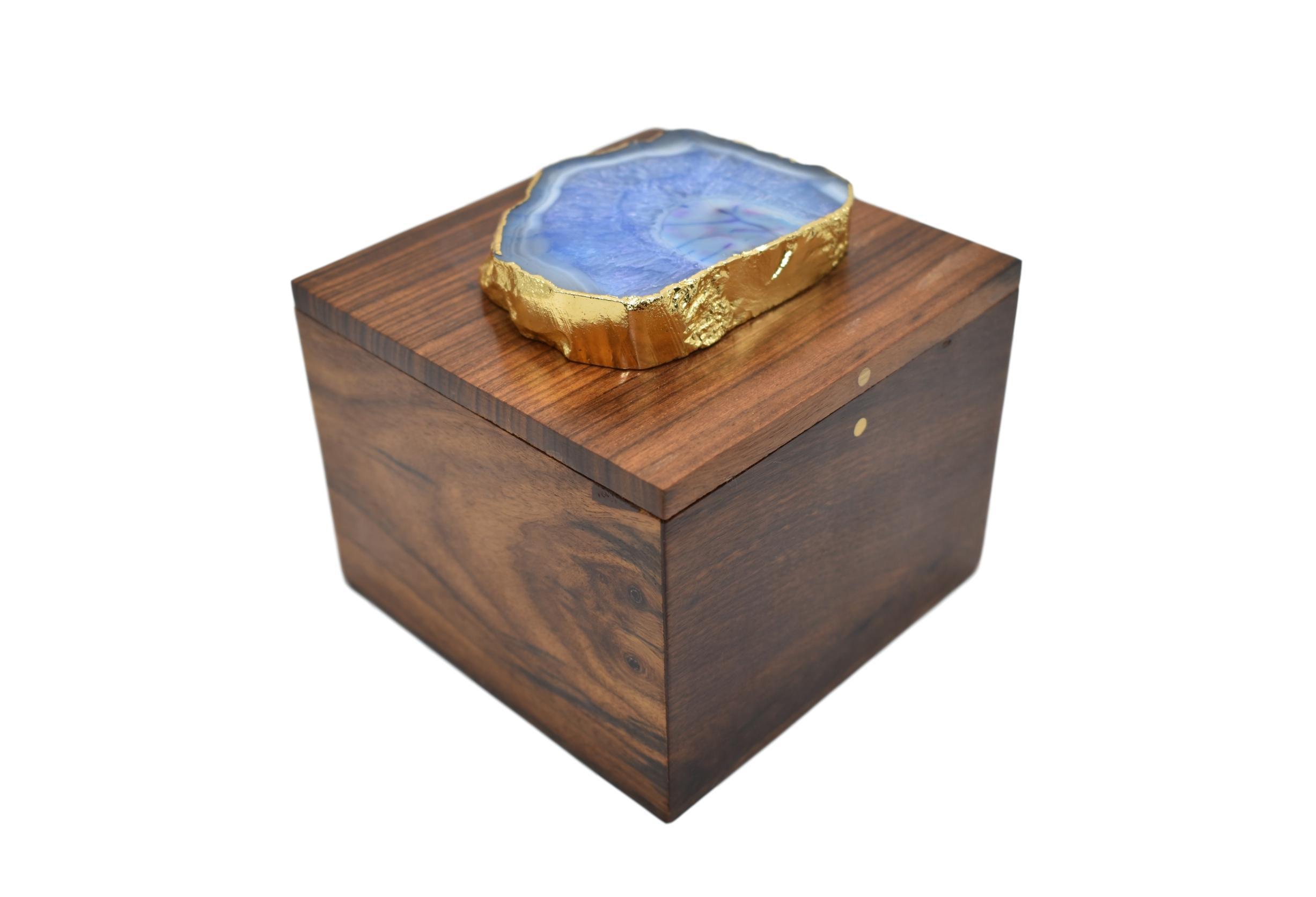 A square wooden box featuring a stunning agate top with gold trim, perfect for storing jewelry and enhancing home decor.