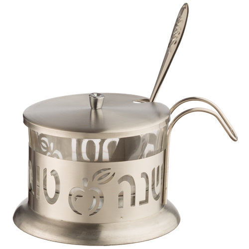 A stylish stainless steel honey jar with a teaspoon and laser-cut festive design.