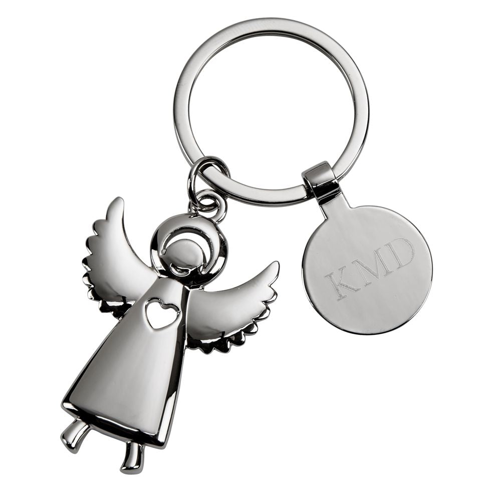 A polished nickel Standing Angel Keychain featuring outstretched wings and a heart-shaped cutout, presented in a black gift box.