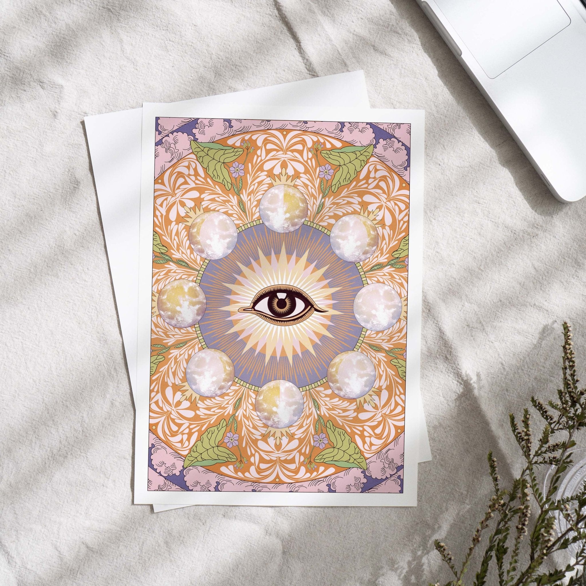 Starry Eyed Art Print featuring an all-seeing eye design surrounded by moons and floral patterns, printed on high-quality paper.