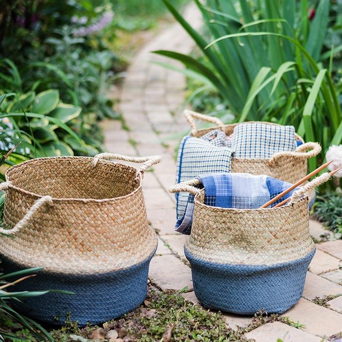 A stylish Straw Basket Pop Up Belly Basket in natural straw with colorful options, showcasing its unique pop-up design and various sizes.